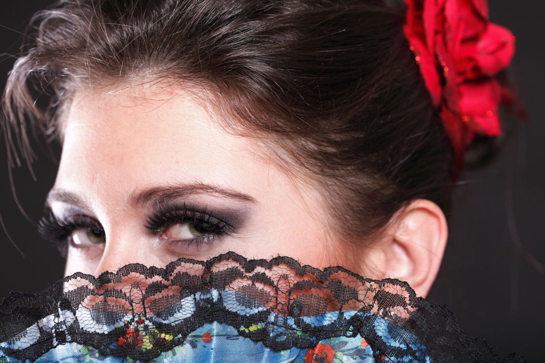 Attractive spanish dancer over black background young woman dancing flamenco Young Attractive Woman